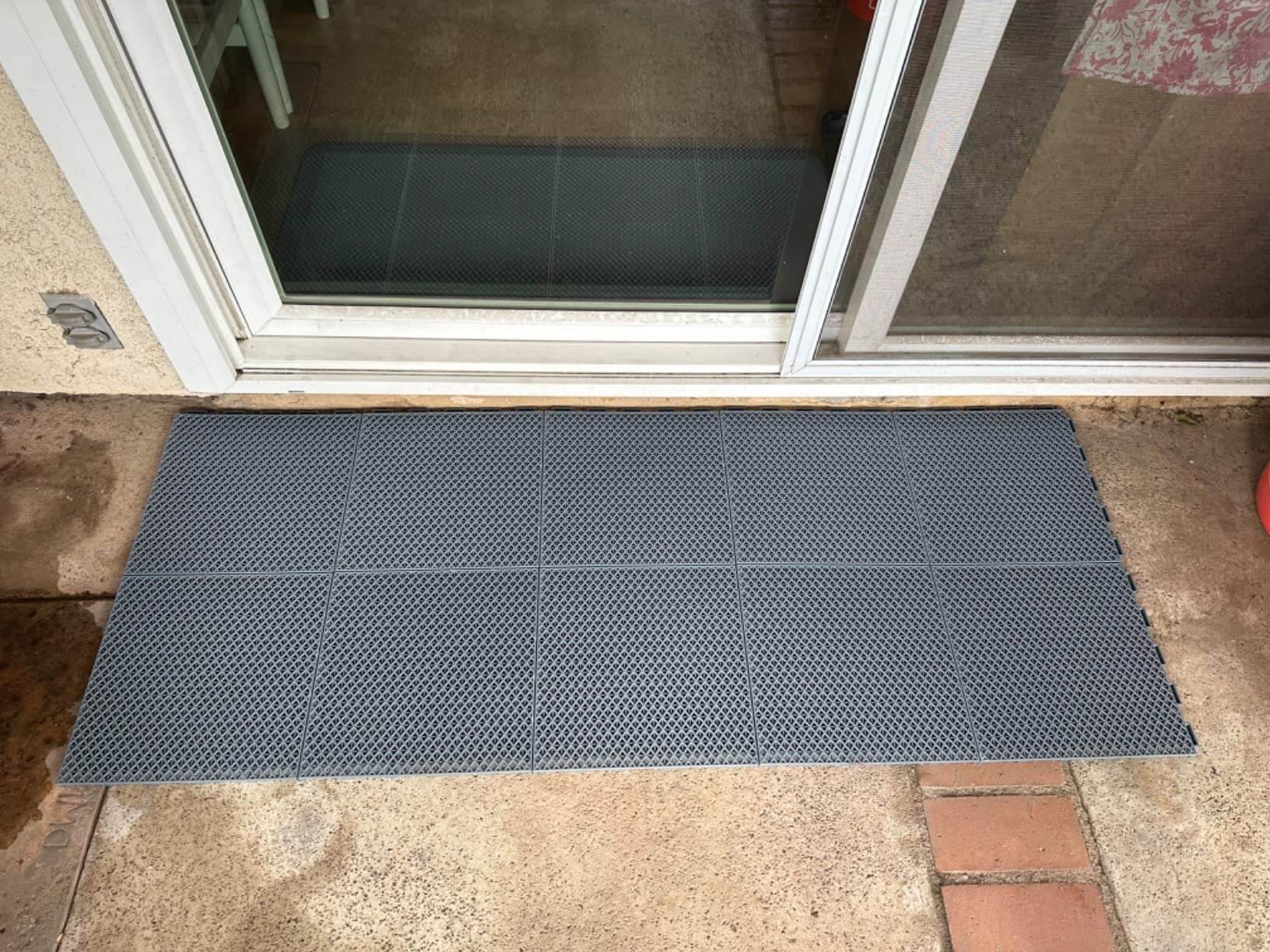 Backyard patio drainage floor